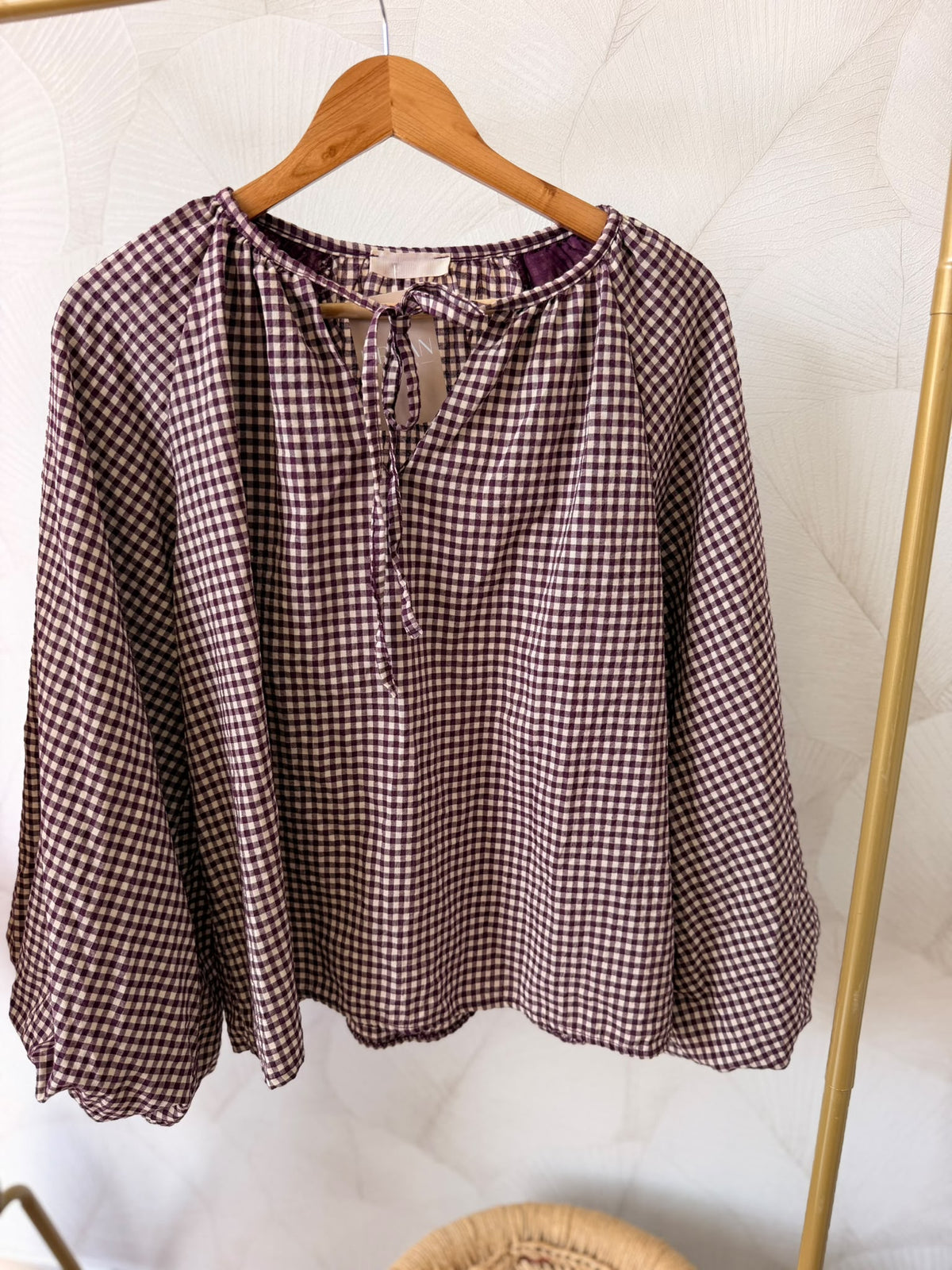 Blusa em padrão xadrez na cor roxo